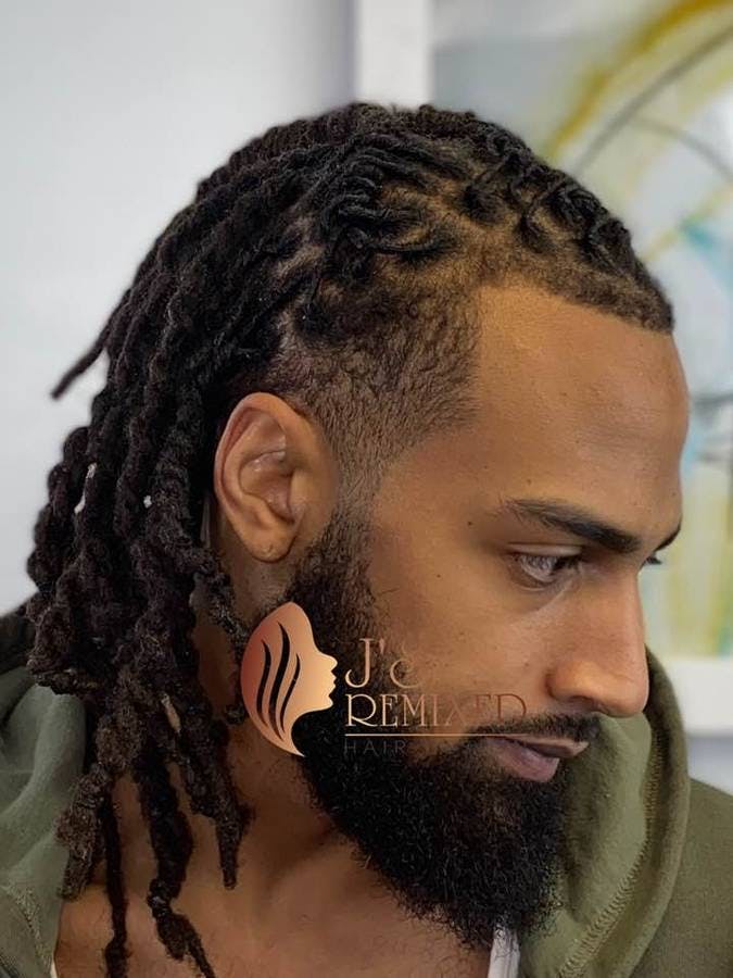 picture of an african american man with braids